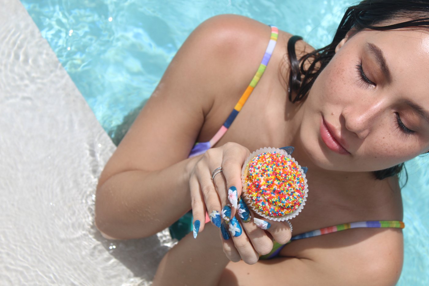 Rainbow sprinkle cupcake paired with 3D coral relief nails